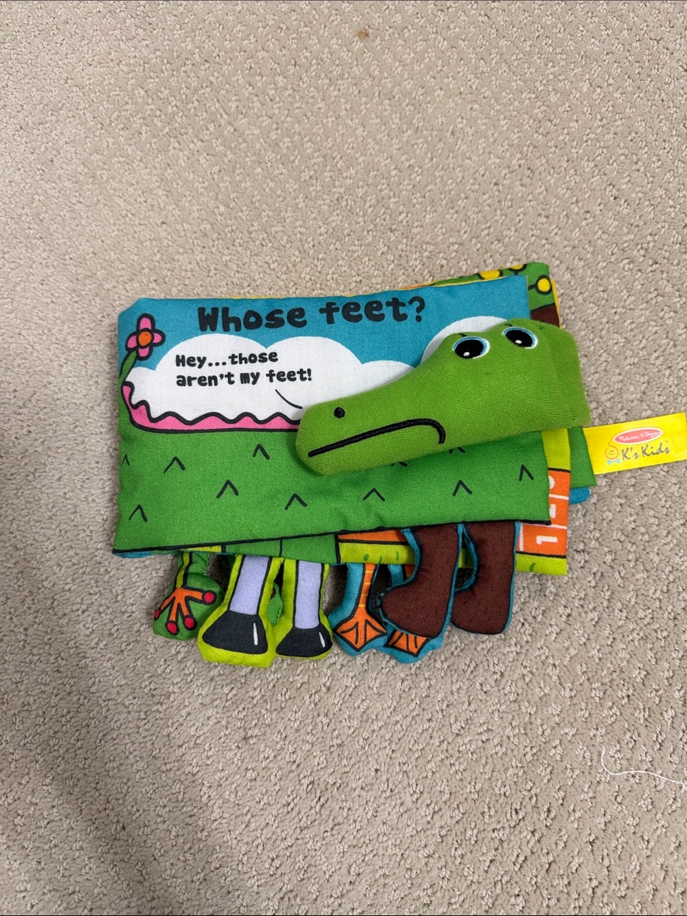 Melissa & Doug Soft Cloth Peekaboo Book in Green, Blue, Brown, Yellow, Orange